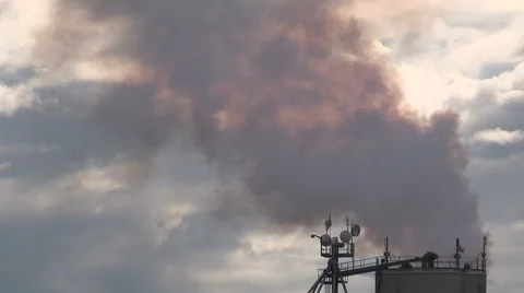Smoke stacks from industry belching carbon and gases into the environment Stock Footage 53038486