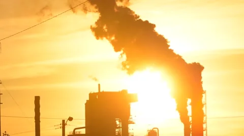 Smoke Stacks from Oil Refinery at Sunset Stock Footage 64952193