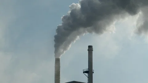 Smoke stacks producing pollution into the atmosphere in slow motion, 4k Stock Footage 112274743