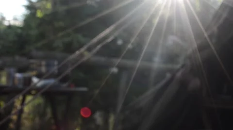 Smoke in sun rays in a tranquil camping scene, with green canvas tent. Stock Footage 65722038