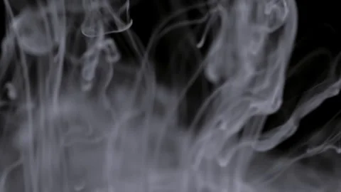 Smoke swirls create mysterious visual effects in dark background Vídeos de archivo 313872267