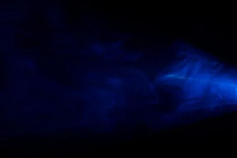 Smoke texture or pattern in the air , bright light effect realistic at dark b Фото