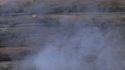 Smoke throu driftwood Stock Footage 186985010