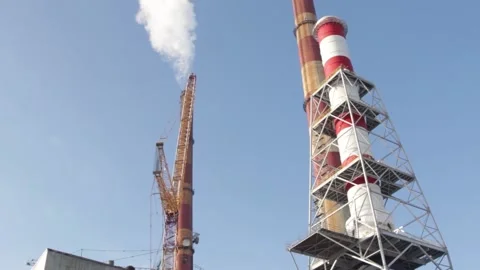 Smoke from tower at the construction site of the coal-fired power station Stock Footage 137576131