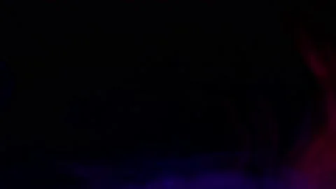 Smoke from Ultrasonic Aroma Diffuser and colorful light on black background. Stock Footage 225057803