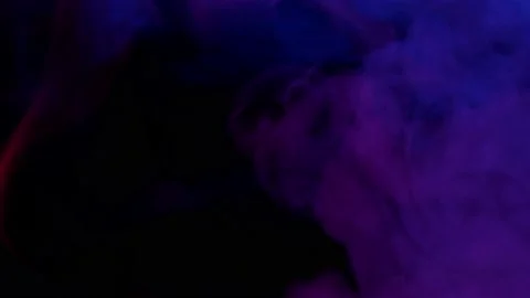 Smoke from Ultrasonic Aroma Diffuser and colorful light on black background. Stock Footage 225057874