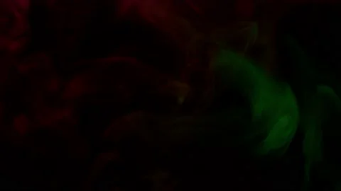 Smoke from Ultrasonic Aroma Diffuser and colorful light on black background. Stock Footage 238748935