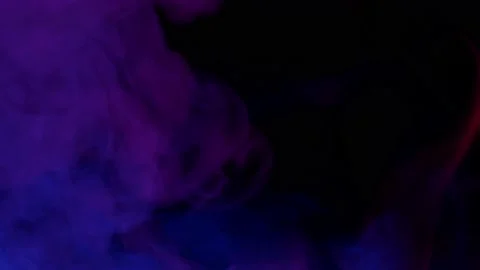 Smoke from Ultrasonic Aroma Diffuser and colorful light on black background. Video stock 238749034