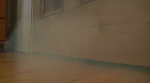 Smoke under door Stock Footage 22666383