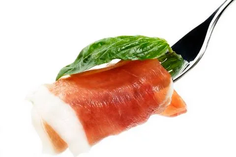Smoked bacon on a fork Stock Photos