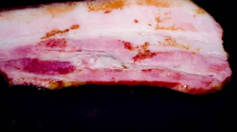 Smoked bacon fried in a pan Stock Footage 46807755