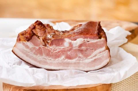 Smoked bacon portion lying Stock Photos