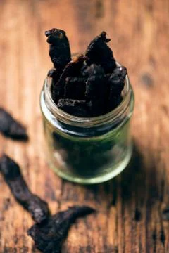 Smoked beef jerky on on a table Stock Photos