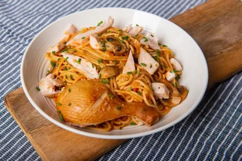 Smoked chicken with spaghetti and chives Stock Photos