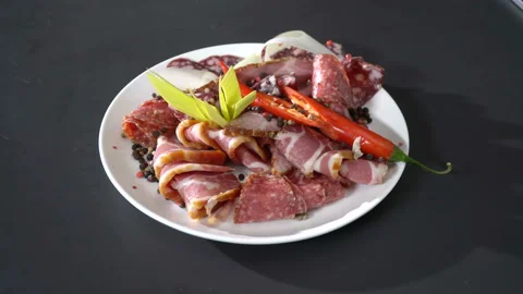 Smoked cold cuts on a plate 스톡 동영상 100732136
