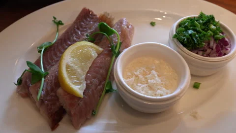 Smoked eel served on a plate with lemon and parsley. Stock Footage 301427283