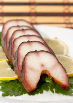 Smoked eel steaks Stock Photos