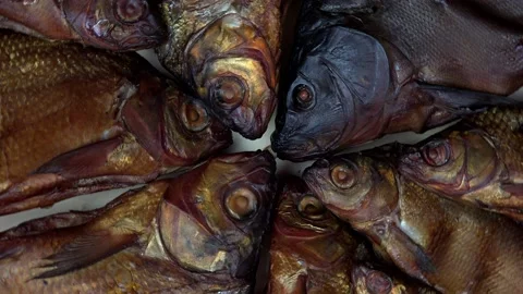 Smoked fish rotating turntable clockwise. 4K Stock Footage 133712088