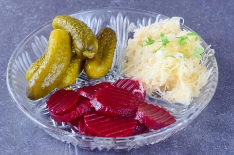 Smoked mackerel, pickled cucumbers, beetroot, sauerkraut, french fries Stock Photos