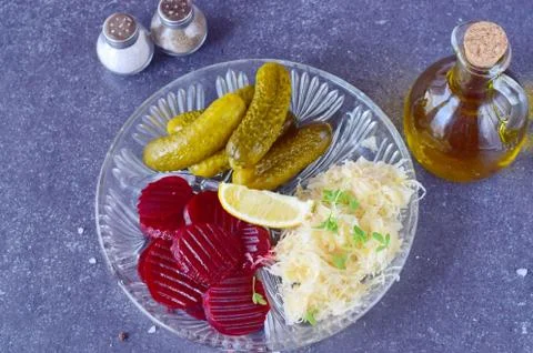Smoked mackerel, pickled cucumbers, beetroot, sauerkraut, french fries Stock Photos