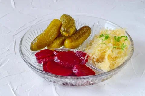 Smoked mackerel, pickled cucumbers, beetroot, sauerkraut, french fries Stock Photos