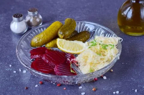 Smoked mackerel, pickled cucumbers, beetroot, sauerkraut, french fries Stock Photos