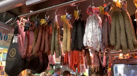 Smoked meats in the market La Boqueria in Barcelona Stock Footage