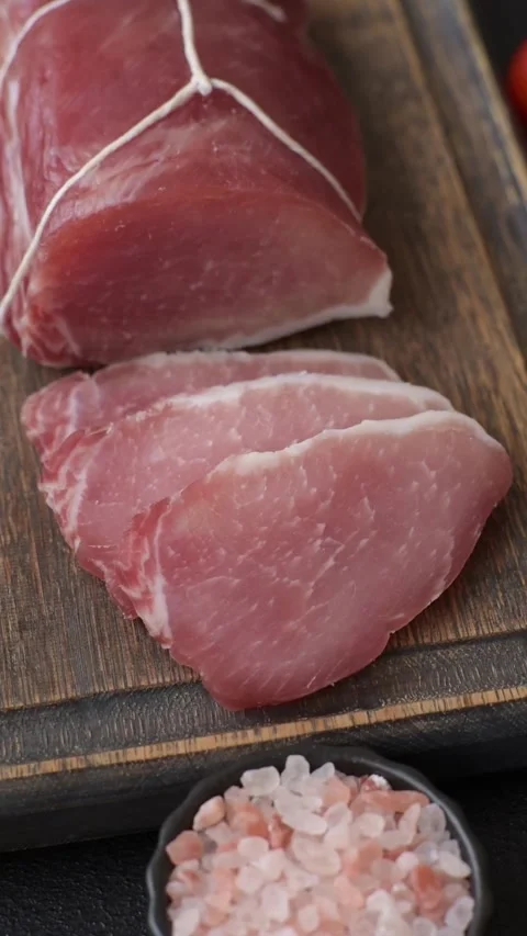 Smoked or dry cured meat slices, pork or ham with salt and spices. Smoked meat s Stock Footage 333073223