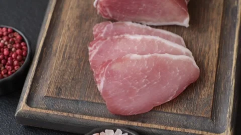 Smoked or dry cured meat slices, pork or ham with salt and spices. Smoked meat s Stock Footage 333073228