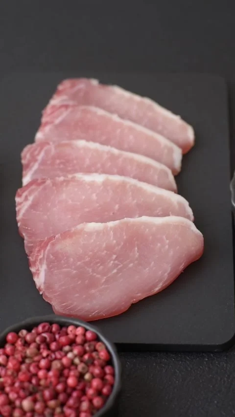 Smoked or dry cured meat slices, pork or ham with salt and spices. Smoked meat s Stock Footage 333073242