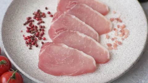 Smoked or dry cured meat slices, pork or ham with salt and spices. Smoked meat s Stock Footage 333073244