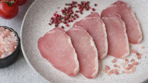 Smoked or dry cured meat slices, pork or ham with salt and spices. Smoked meat s Stock Footage 333073245