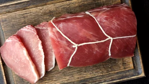 Smoked or dry cured meat slices, pork or ham with salt and spices. Smoked meat s Stock Footage 333073265