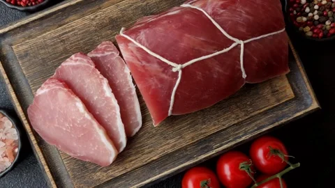 Smoked or dry cured meat slices, pork or ham with salt and spices. Smoked meat s Stock Footage 333073278