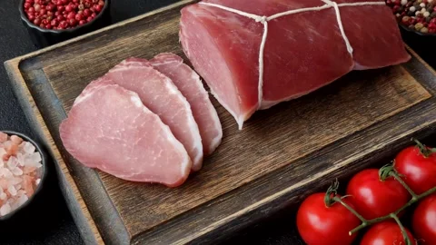 Smoked or dry cured meat slices, pork or ham with salt and spices. Smoked meat s Stock Footage 333073281