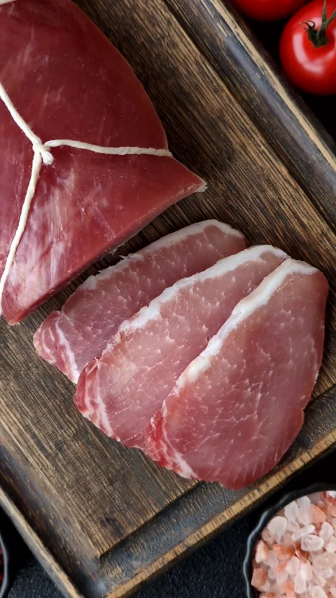 Smoked or dry cured meat slices, pork or ham with salt and spices. Smoked meat s Stock Footage 333073295