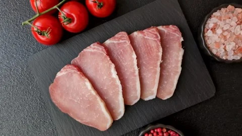 Smoked or dry cured meat slices, pork or ham with salt and spices. Smoked meat s Stock Footage 333073299