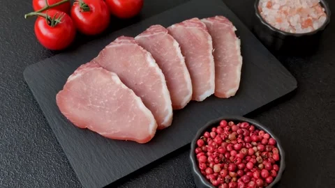 Smoked or dry cured meat slices, pork or ham with salt and spices. Smoked meat s Stock Footage 333073302