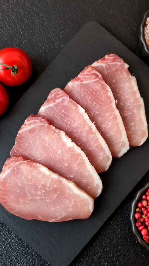 Smoked or dry cured meat slices, pork or ham with salt and spices. Smoked meat s Stock Footage 333073306