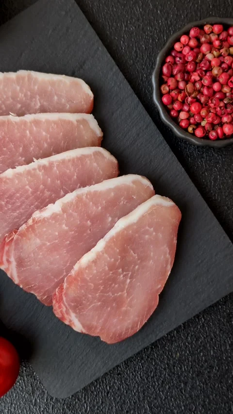 Smoked or dry cured meat slices, pork or ham with salt and spices. Smoked meat s Stock Footage 333073316