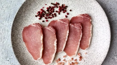 Smoked or dry cured meat slices, pork or ham with salt and spices. Smoked meat s Stock Footage 333073319