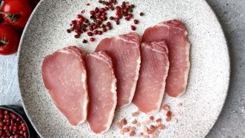 Smoked or dry cured meat slices, pork or ham with salt and spices. Smoked meat s Stock Footage 333073320