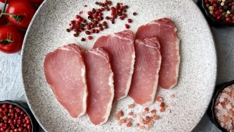 Smoked or dry cured meat slices, pork or ham with salt and spices. Smoked meat s Stock Footage 333073323