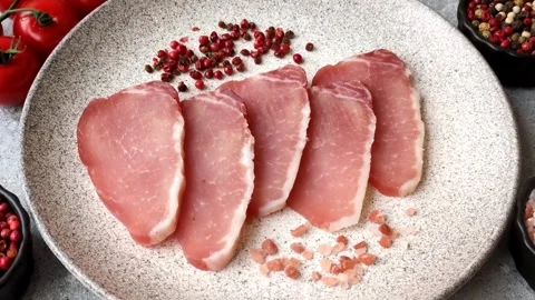 Smoked or dry cured meat slices, pork or ham with salt and spices. Smoked meat s Stock Footage 333073324