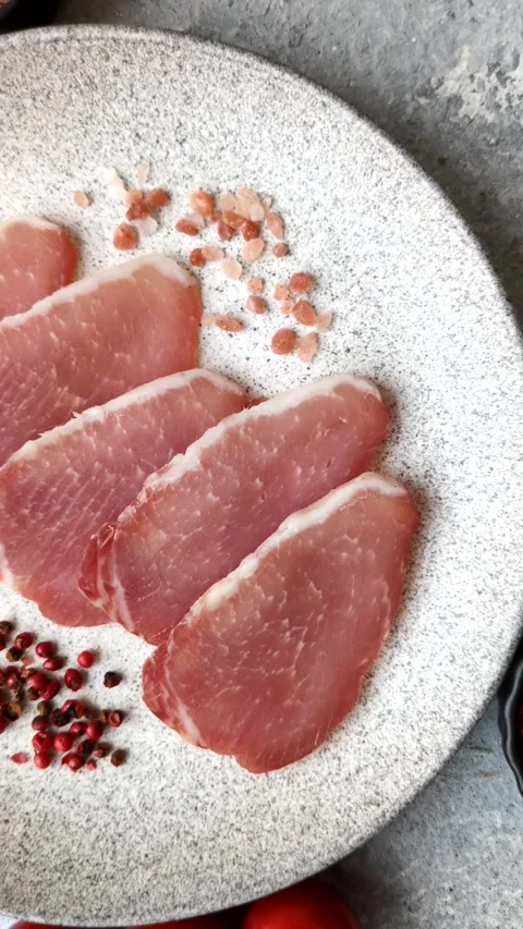 Smoked or dry cured meat slices, pork or ham with salt and spices. Smoked meat s Stock Footage 333073331