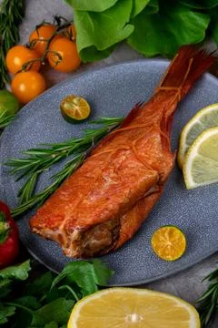 Smoked redfish served on the gray plate Stock-Fotos