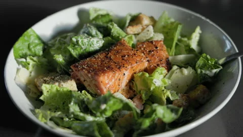Smoked salmon caesar salad with parmesan, croutons and crispy roman lettuce Stock Footage 202292010