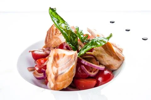Smoked salmon with tomatoes on white background Stock Photos