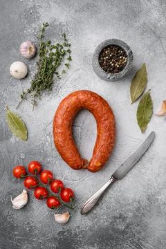 Smoked wurst, on gray stone table background, top view flat lay Stock Photos