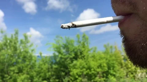Smokes a cigarette Stock Footage 78783955
